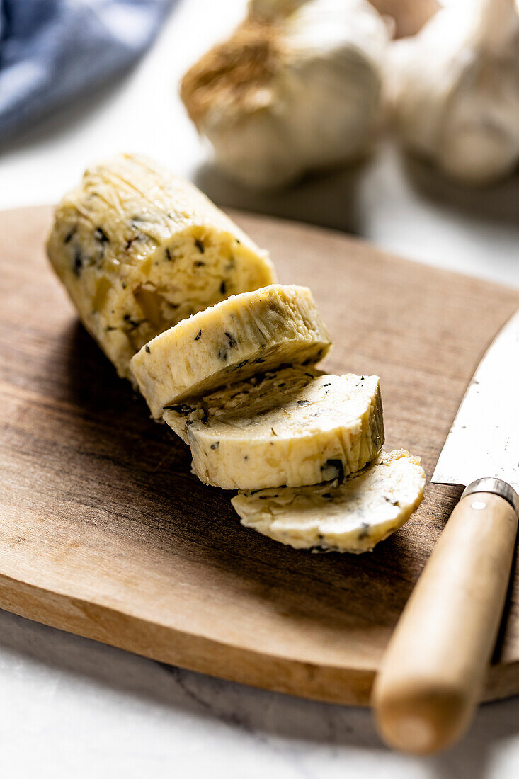 Homemade garlic butter on a chopping board