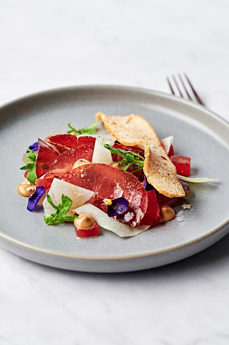 Shaved beef bresaola, pickled watermelon, fermented black garlic aioli, kohlrabi, herb oil