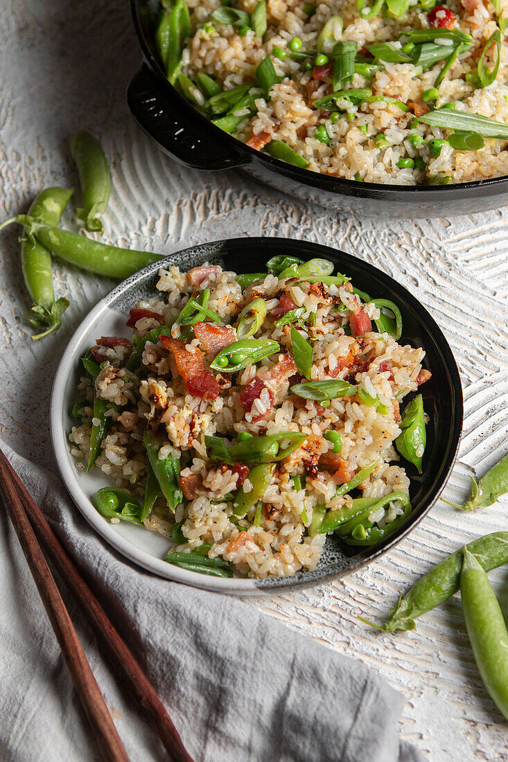 Fried rice with bacon and mangetout