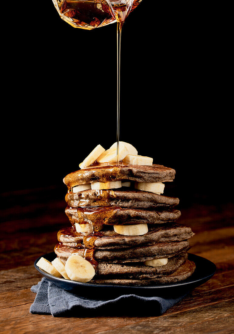 Stack of Vegan Sourdough Buckwheat Pancakes with Maple Syrup
