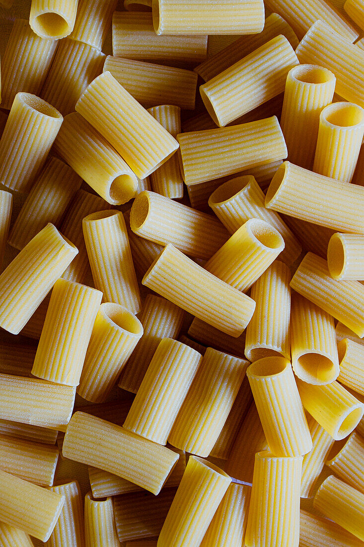 Macro shot of dry rigatoni pasta shapes