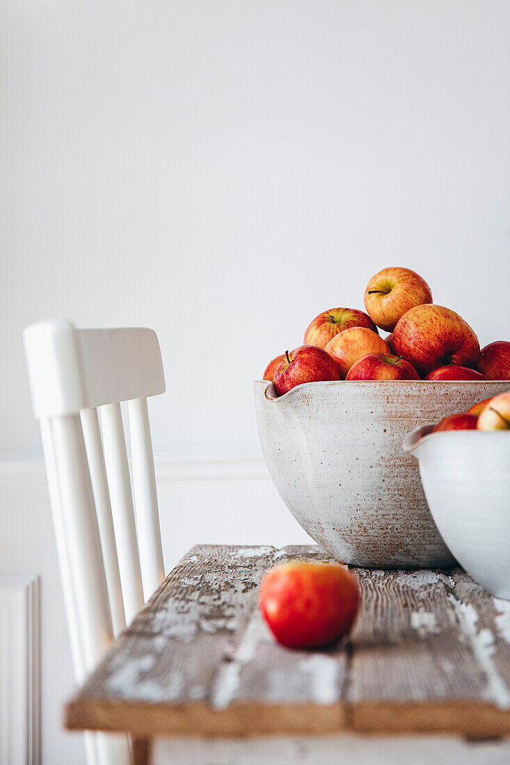 Apples in a basket against a white background