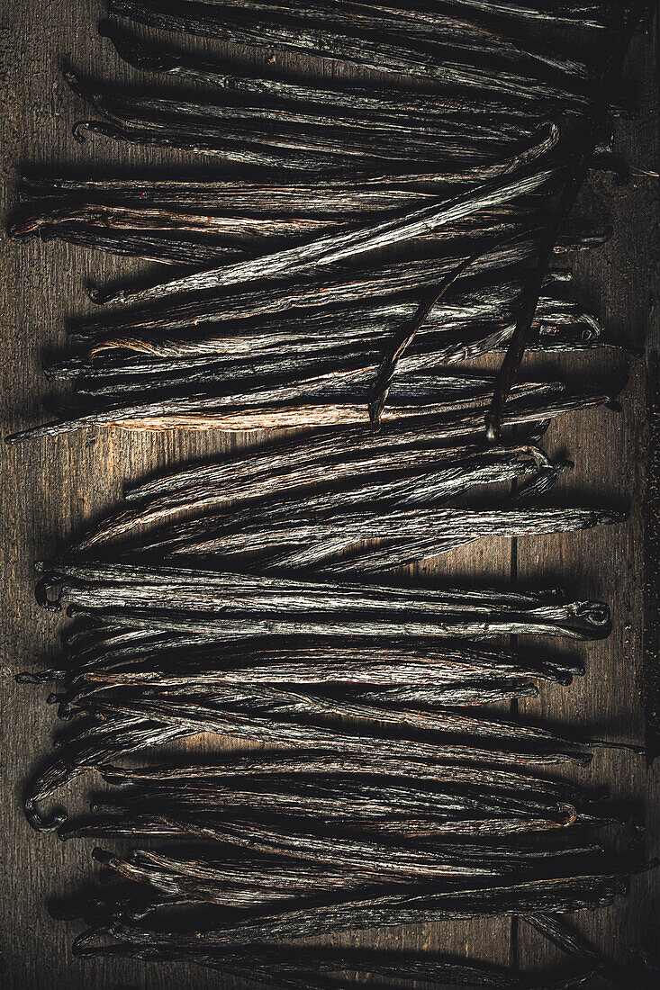 Vanilla pods on a wooden board