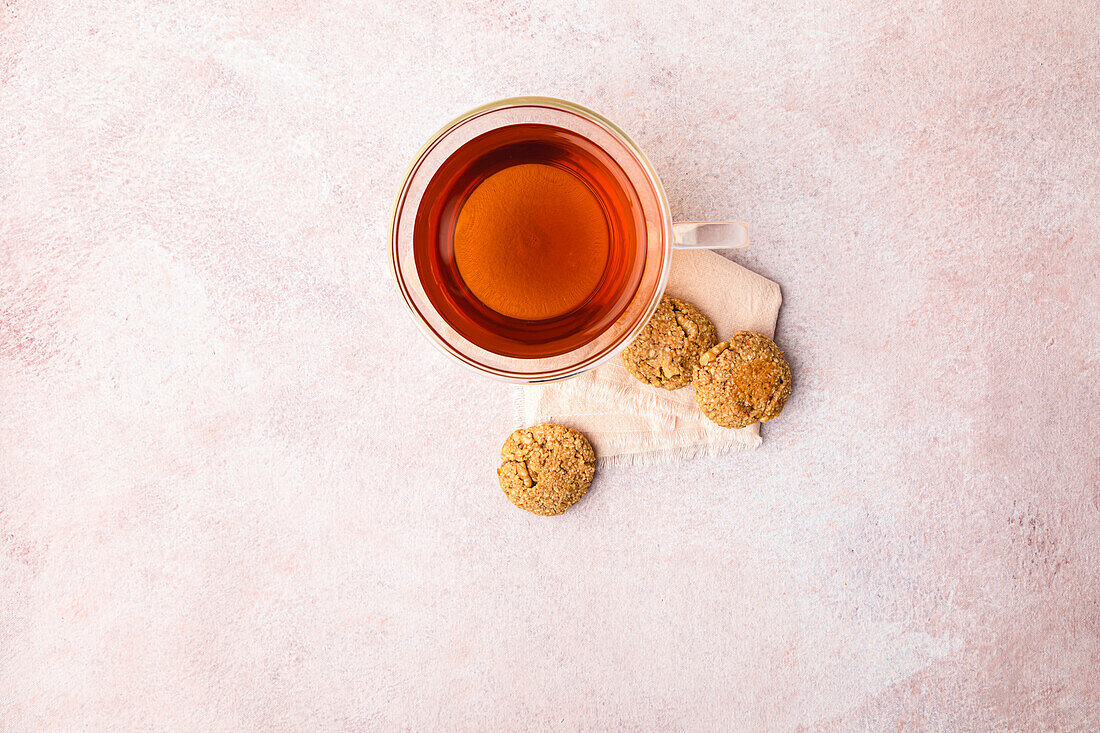 Cup of black tea with homemade oatmeal and walnut biscuits