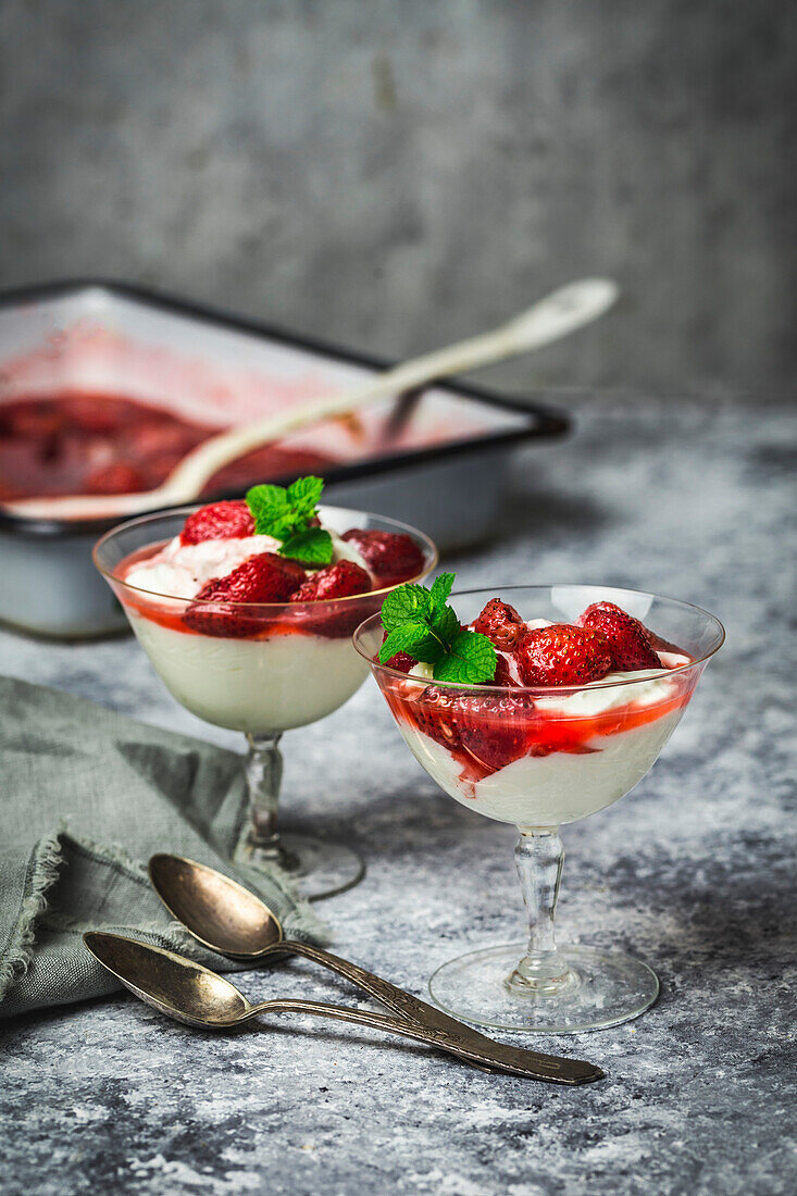 Yoghurt and roasted strawberry parfaits in vintage glasses