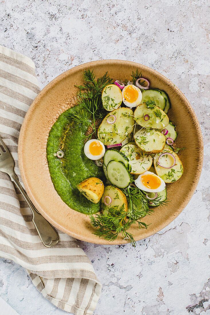 Easter salad with eggs and potatoes, served in a bowl