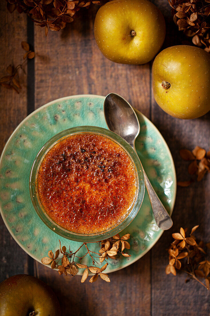 A single portion of classic British Malvern pudding with apple compote and custard