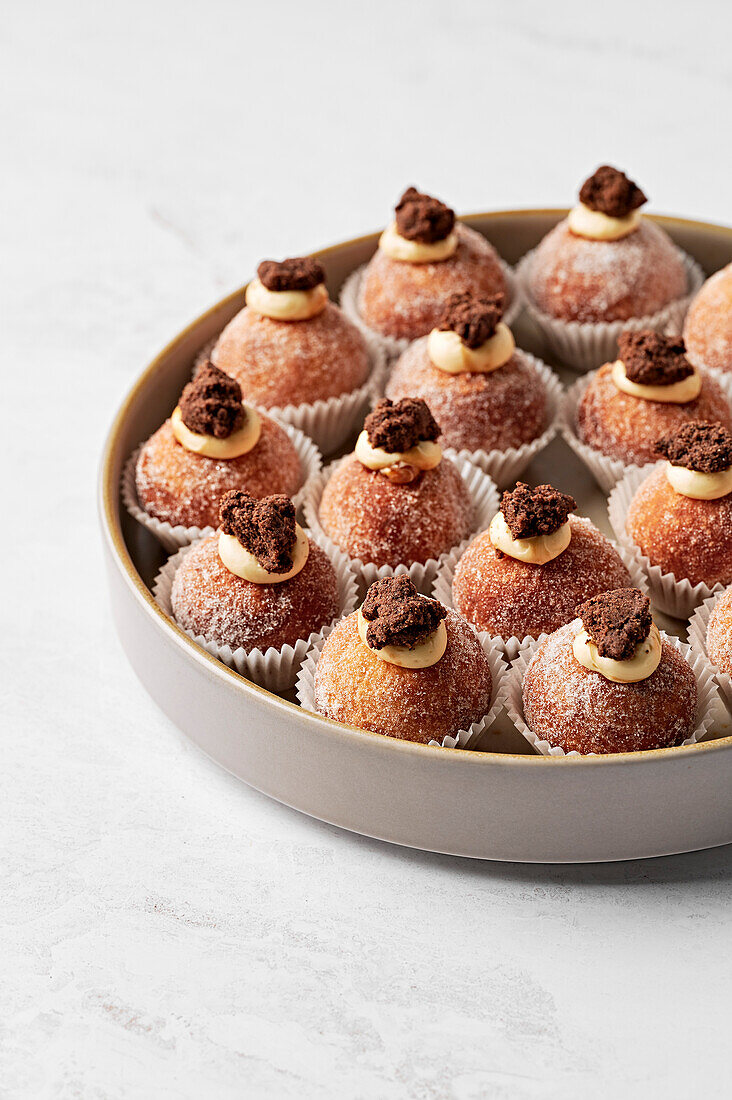 Tiramisu donut, filling of espresso, mascarpone and Kahlua mousse, salted coffee crumbs