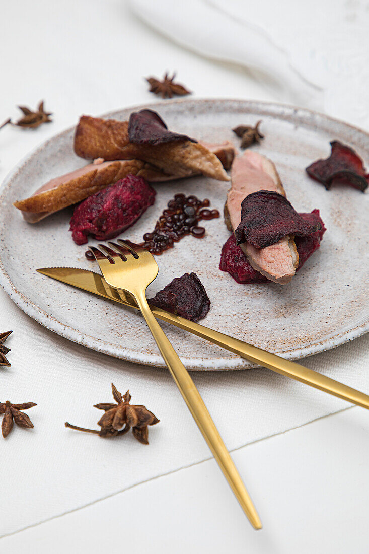 Duck balsamic pearls with beetroot puree and beetroot crisps