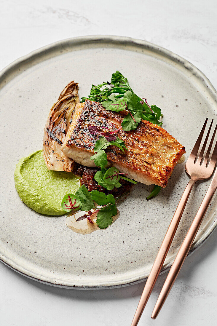 Barramundi fish, leek puree, seafood XO sauce, braised witlof, charred broccolini