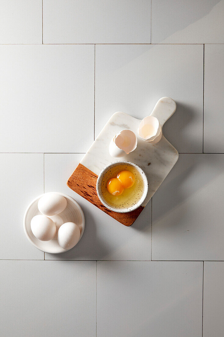 Egg with double yolk whipped in a small bowl