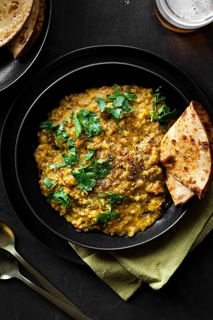 Indian Tarka Dal Curry with Roti and Beer
