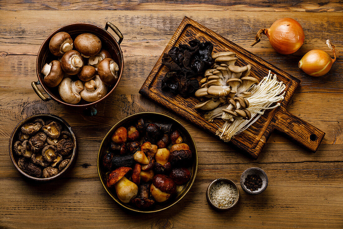 7 types of Mushrooms - Ingredients for Healing soup on wooden table background copy space for design