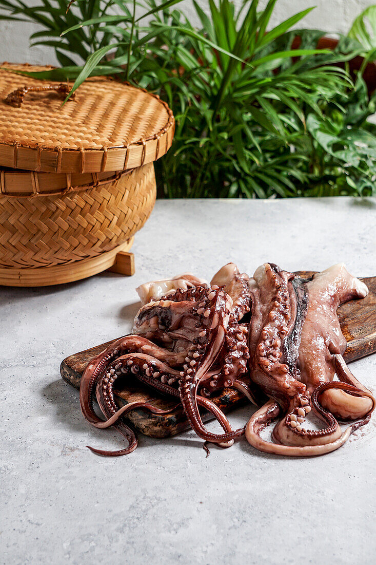 Steamed octopus in an Asian-style bamboo steamer