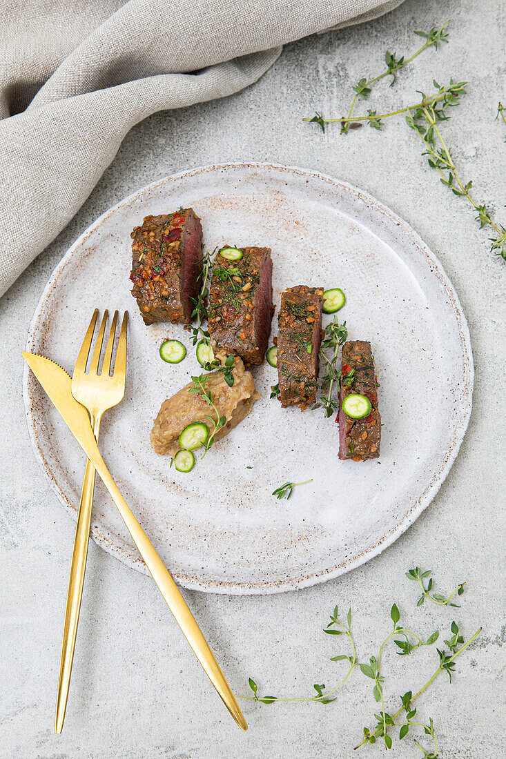 Lamb belly with peas in herb crust and roast potato puree