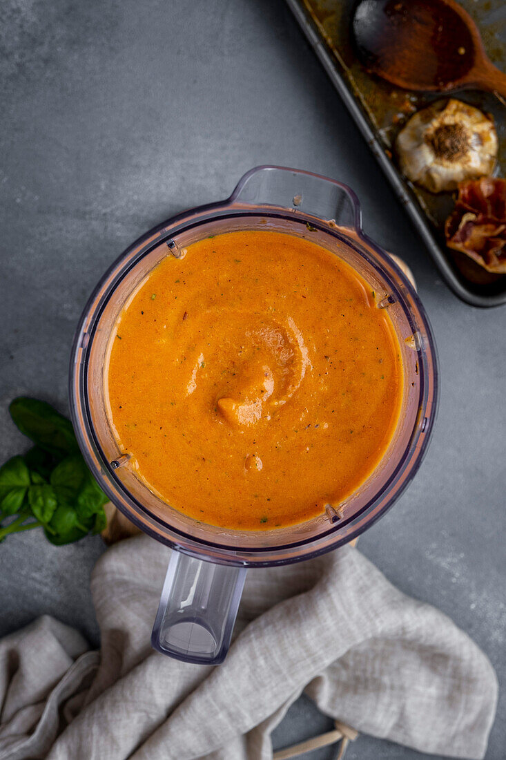 Fried tomato soup, pureed in a food processor container