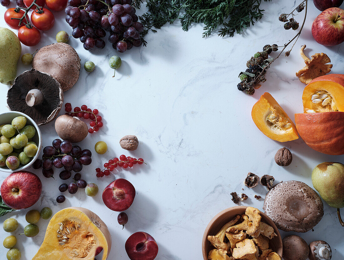 Healthy seasonal vegetarian meal. Flat plate of autumn vegetables, fruit and mushrooms from the local market with text box. Vegan ingredients