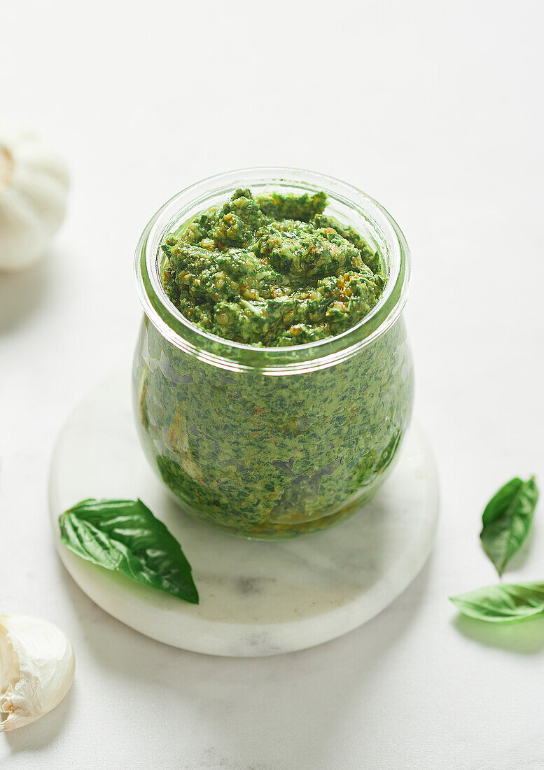 Walnut pesto with basil leaves