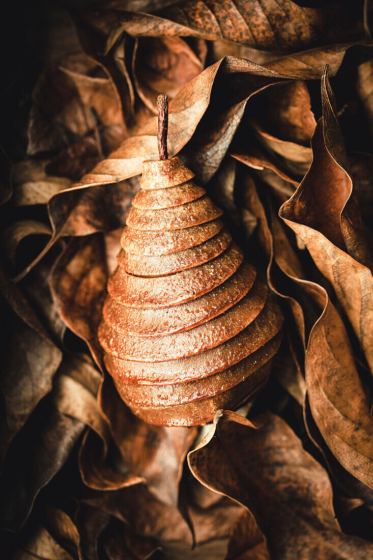 Pear in pie crust, wrapped in leaves