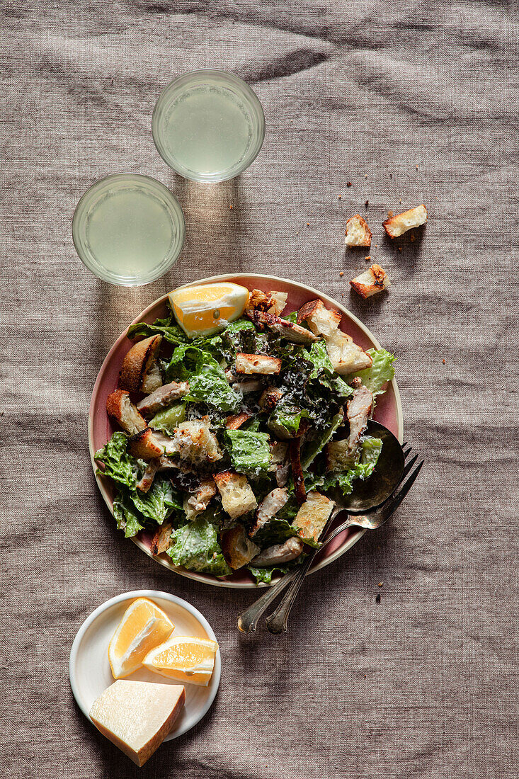 Caesar salad plate with fresh lemonade