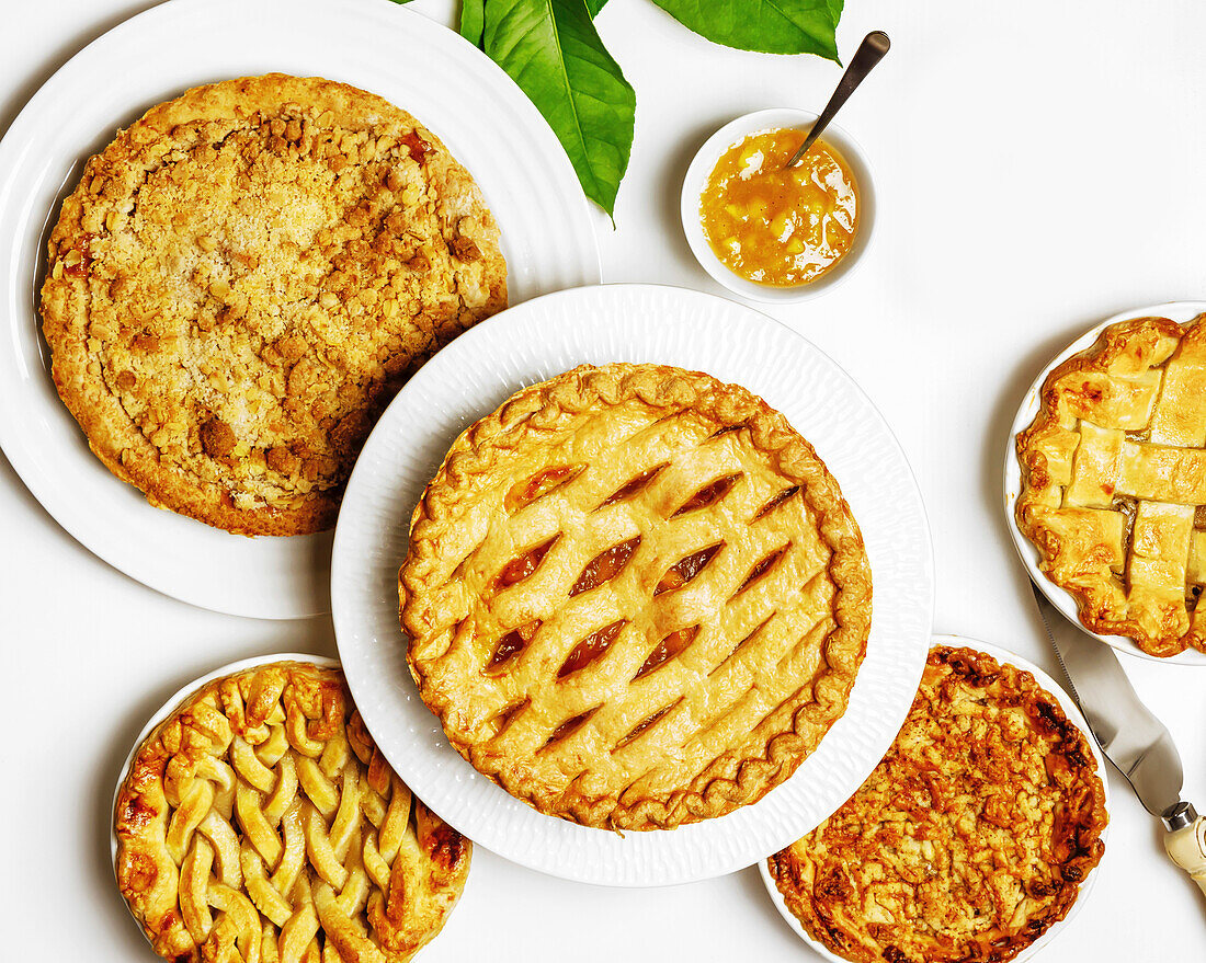 Apple and peach pie on plates