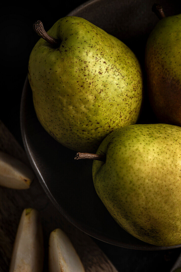 Fresh ripe pears on a plate. Close-up. View from above