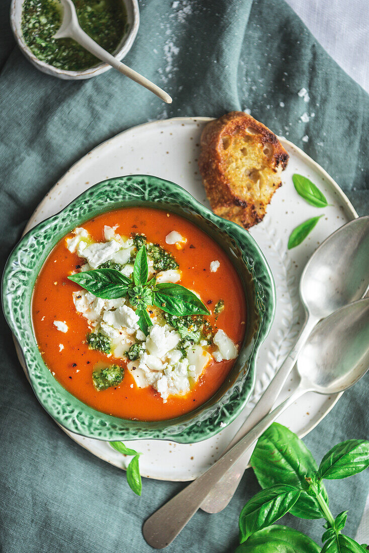 Roasted tomato soup with goat's cheese in a cabbage-shaped bowl