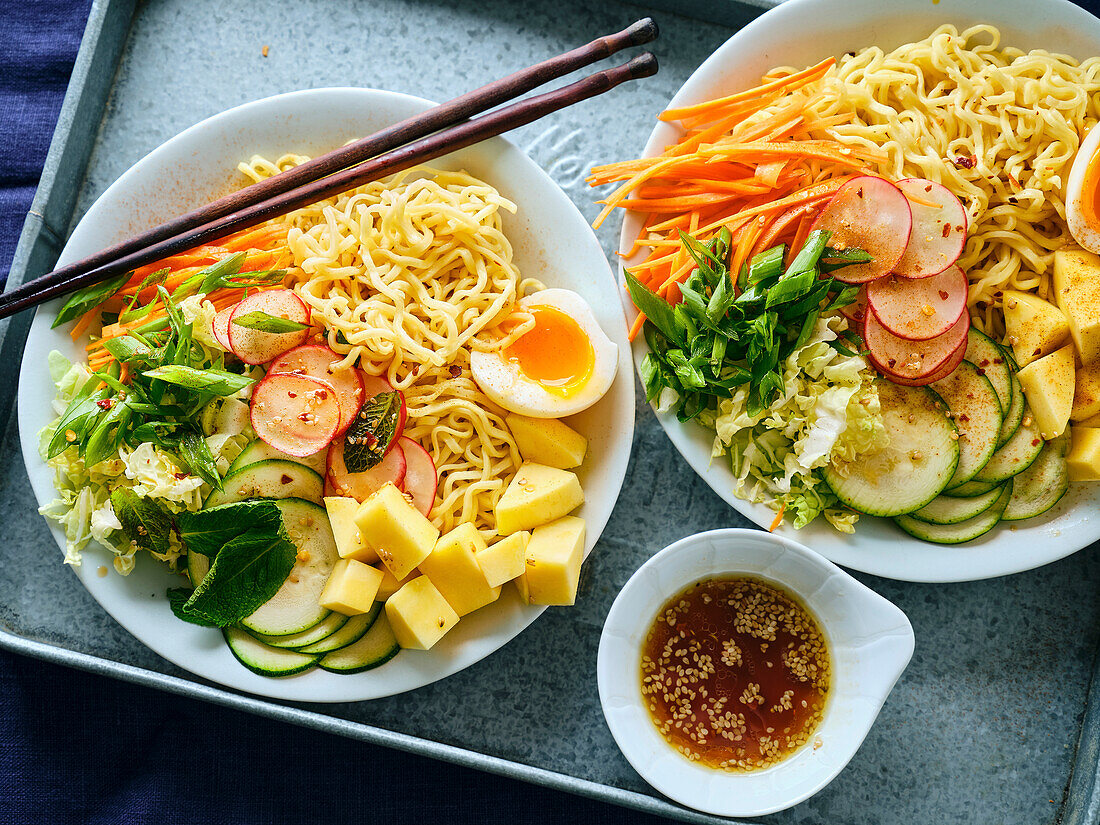 Salad Ramen - vegetarian dish with egg noodles, mango, lime and vegetables. Healthy pan-Asian cuisine