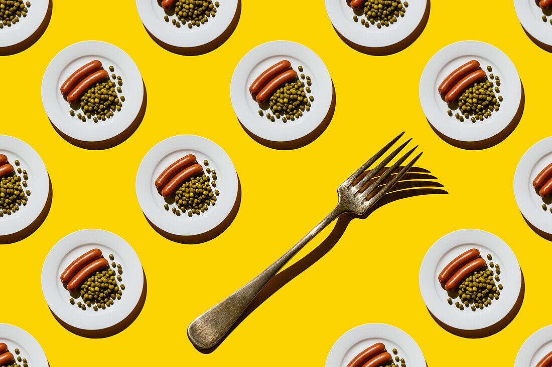 Sausages with Green peas on plate on yellow background Seamless pattern