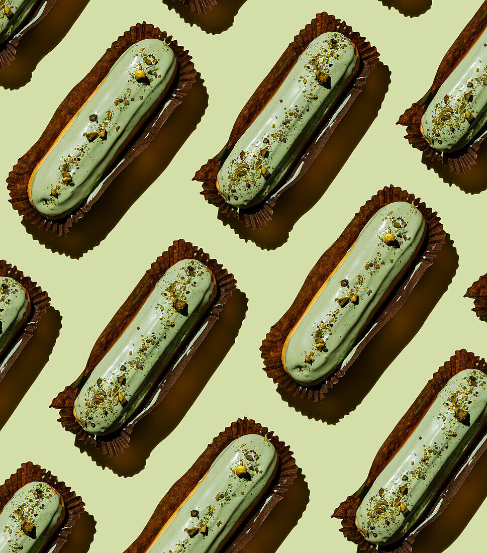 Pistachio eclair on a green background pattern