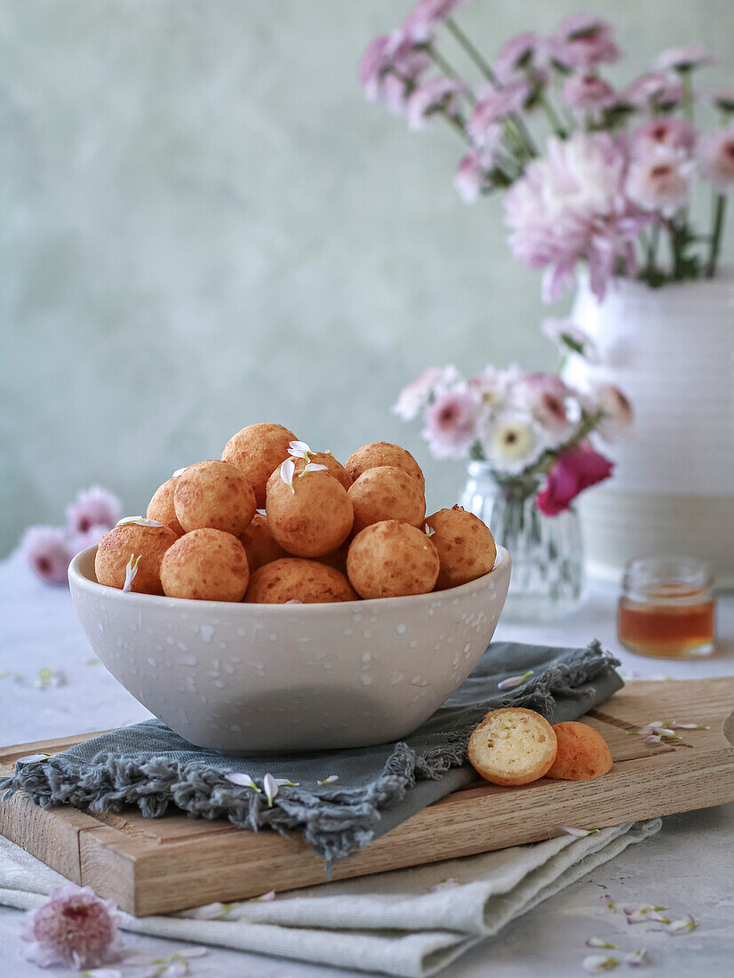 Doughnut in a bowl on a napkin and a cutting board