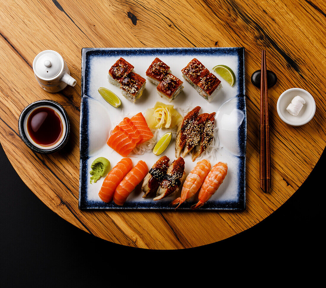 Sashimi and nigiri sushi on a wooden table