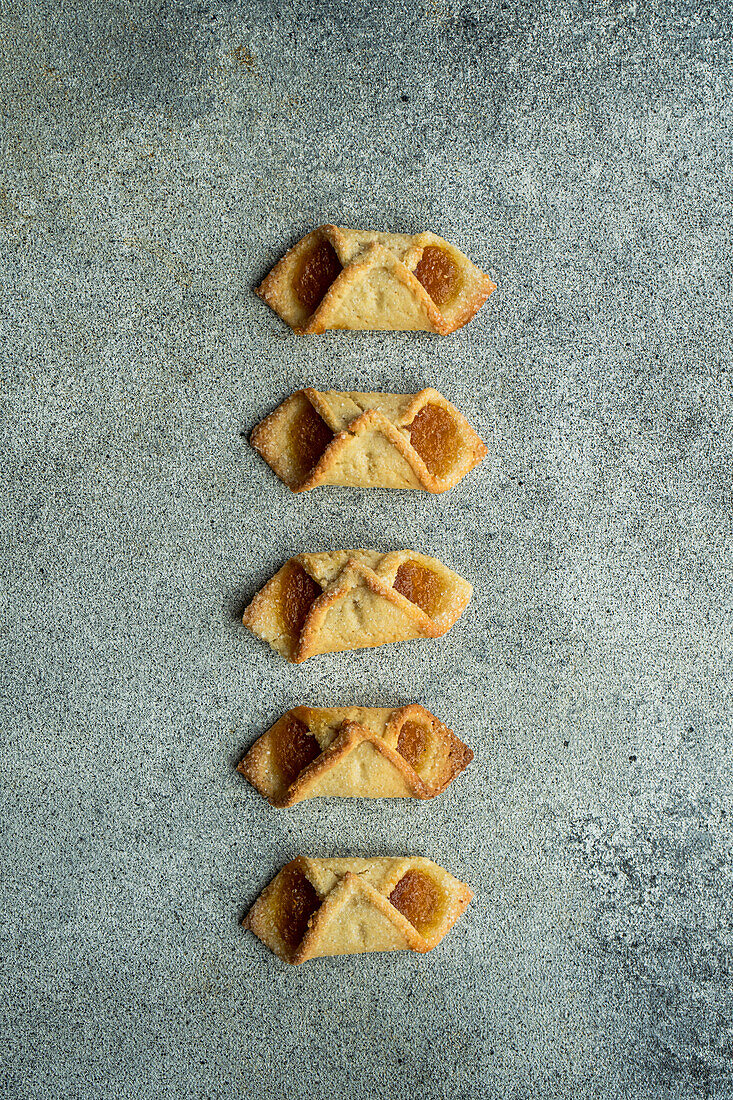 Homemade fresh baked pastry with lemon jam on grey concrete table