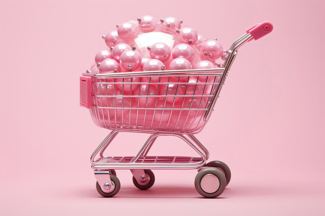 Composition of miniature shopping trolley with assorted multicolored mockup products placed on pink background