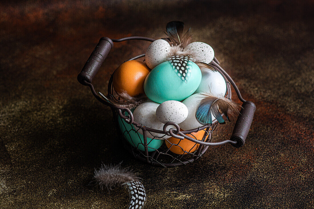 From above basket with easter card concept with eggs on rustic brown background