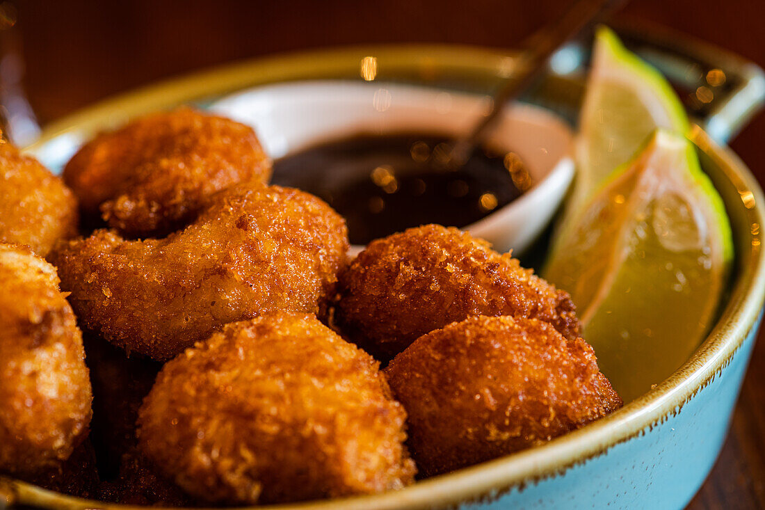 Bang bang Shrimp or butter fried crispy shrimp with fresh lime and berry sauce appetizer in the bowl