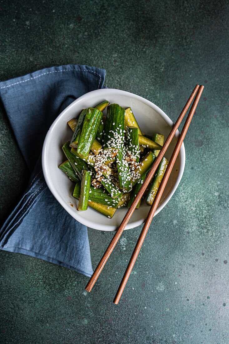 Asian spicy cucumber salad with soy sauce and sesame seeds