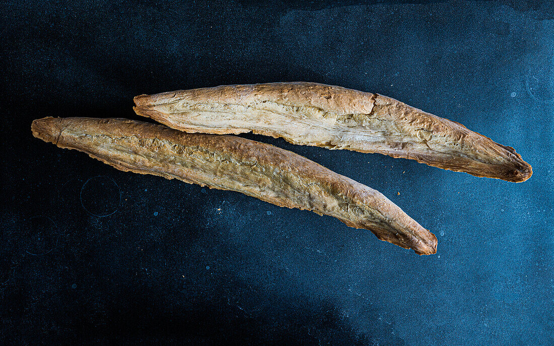 Traditional Georgian bread known as a tonis puri on concrete table