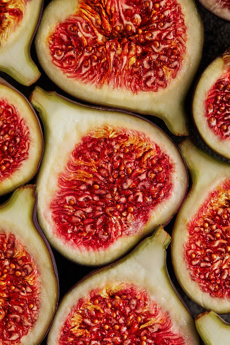Full frame of closeup of halves of yummy figs placed together