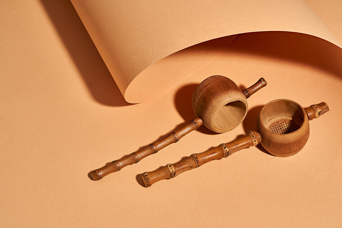 High angle of handmade bamboo tea filters near craft paper background with a beautiful studio