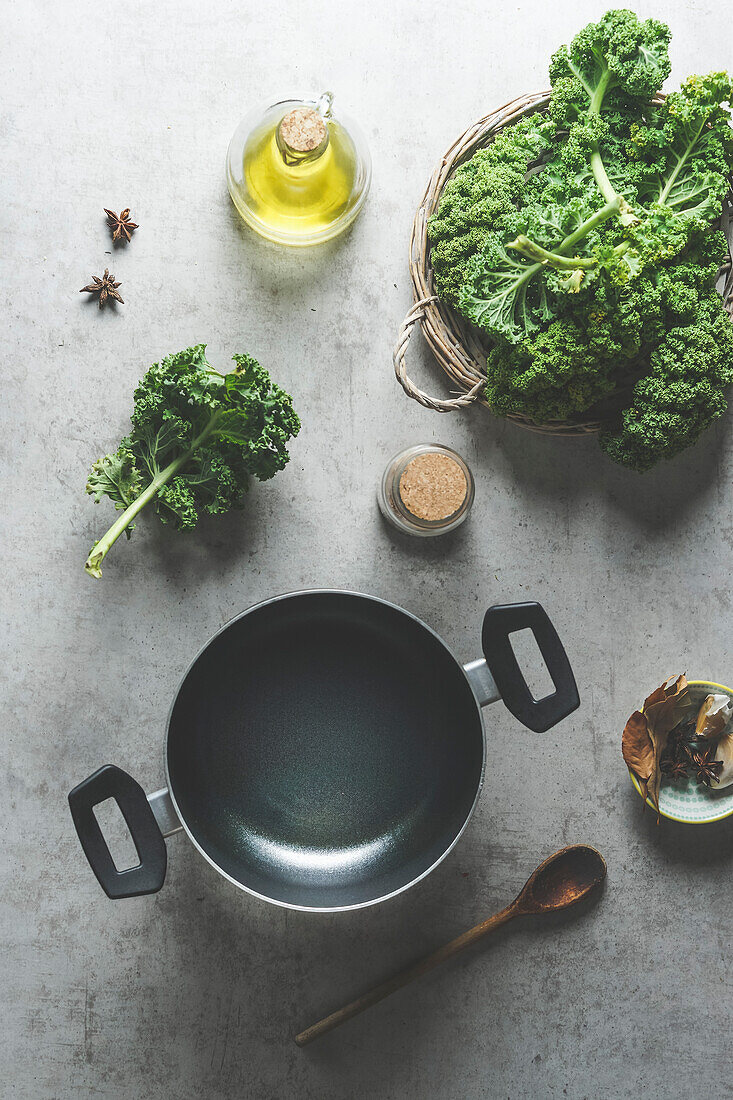 Food, background ,cooking pot , green ,kale ,kale leaves, wooden ,cooking ,spoon ,star anise ,grey, concrete ,kitchen, table, Cooking, preparation ,seasonal ,winter ,cabbage,Top view,
