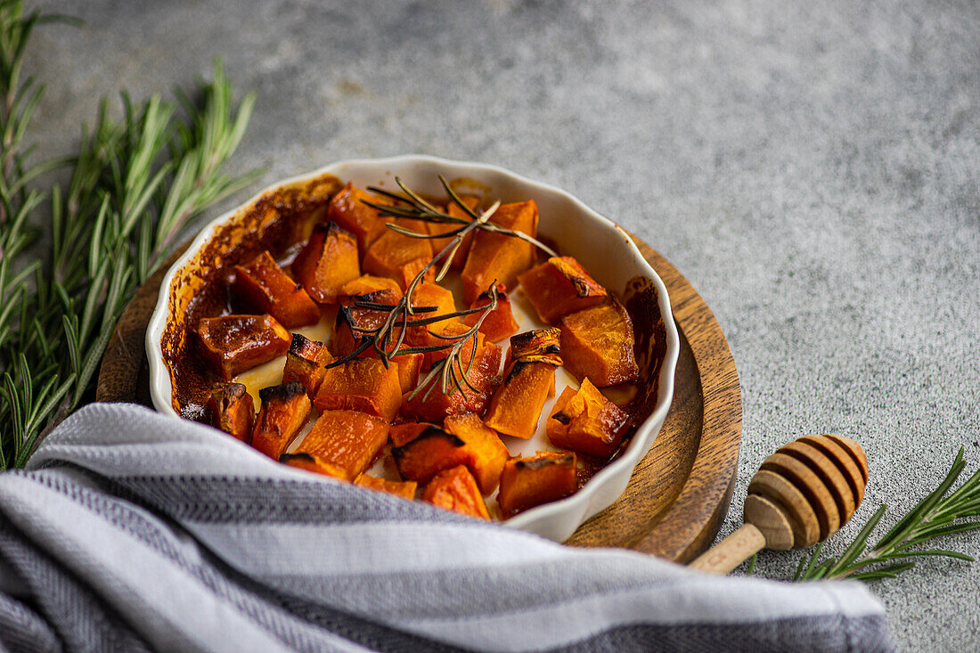 Sweet baked pumpkin cubes in the bowl
