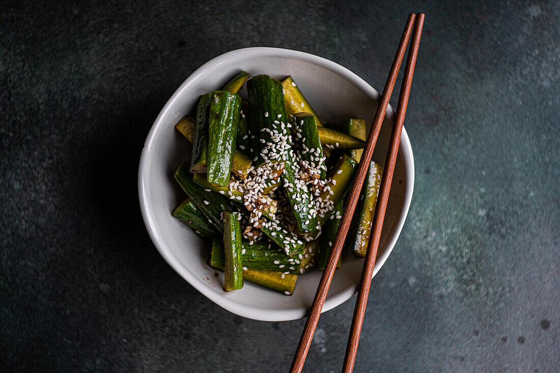 Asian spicy cucumber salad with soy sauce and sesame seeds