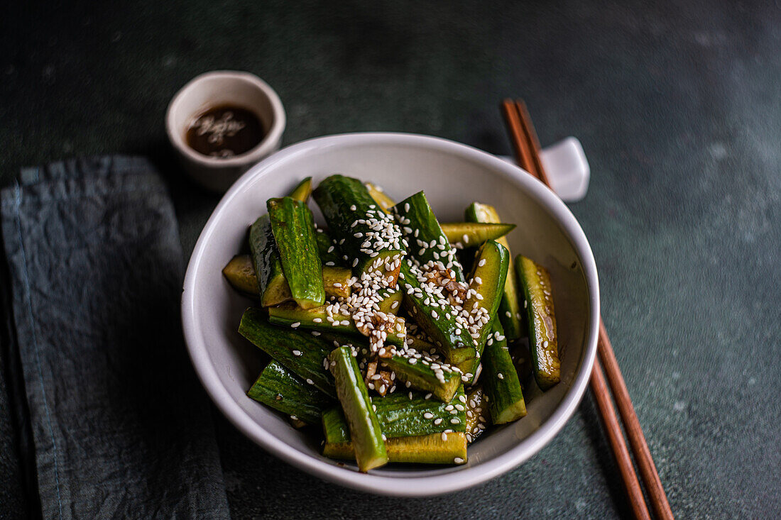 Asian spicy cucumber salad with soy sauce and sesame seeds