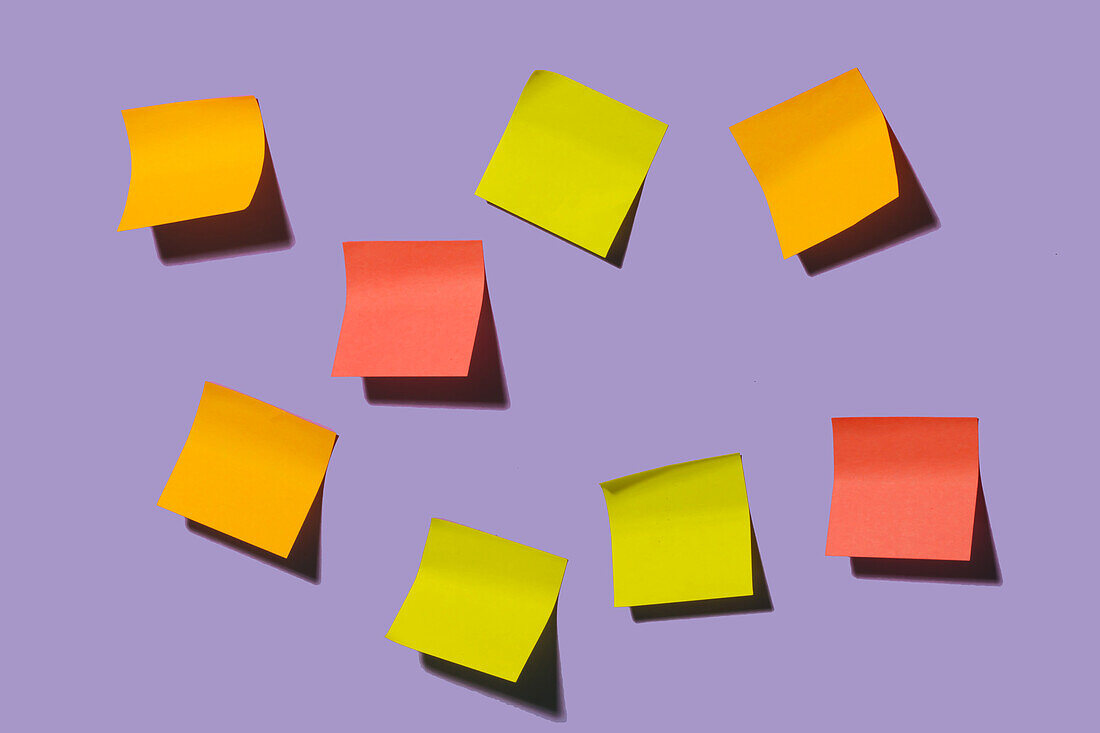 Colorful black sticky notes placed on bright violet background representing concept of idea in creative office