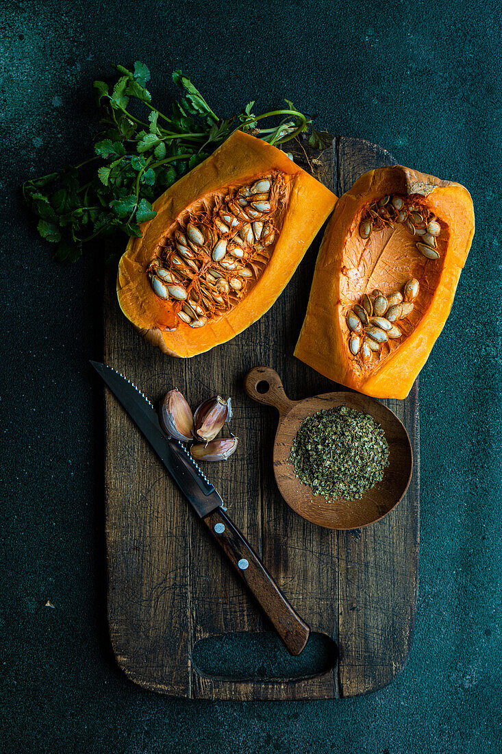 Raw pumpkin and ingredients for cooking healthy lunch dish