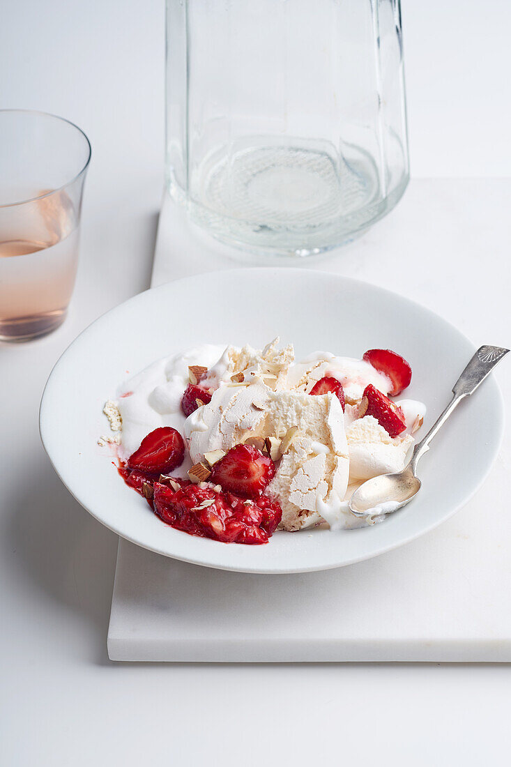 Dessert with berries, meringue and whipped cream. Eton's mess with strawberries, sweet treat with summer mood