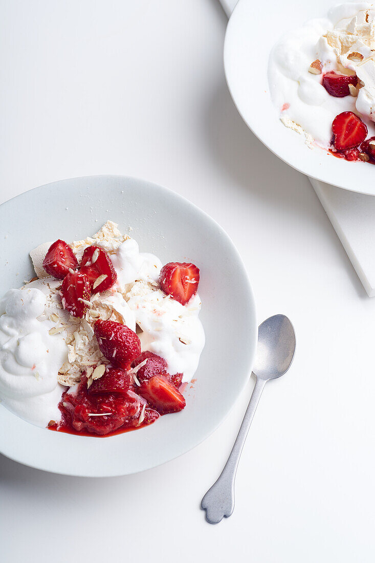 Eton's mess summer dessert with berries, crushed meringue and whipped cream