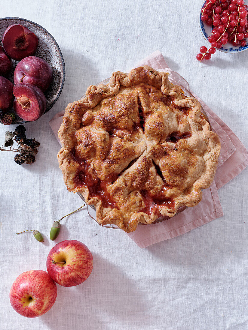 Homemade apple and red currant pie top view