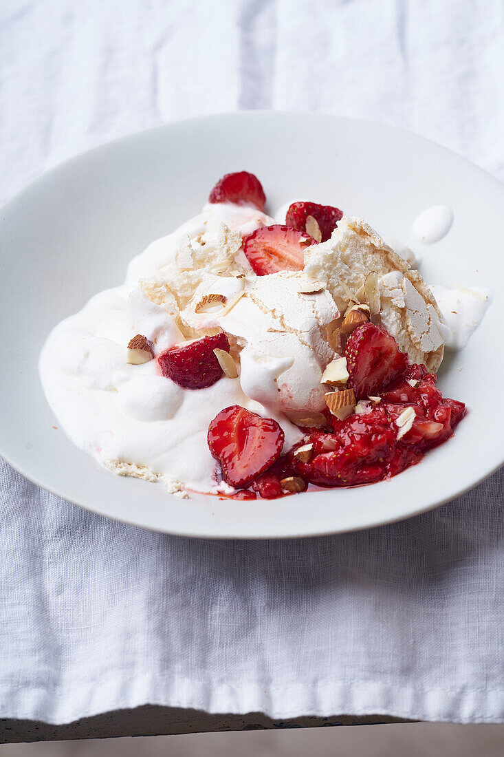 Dessert with strawberries, meringue and whipped cream. Closeup view